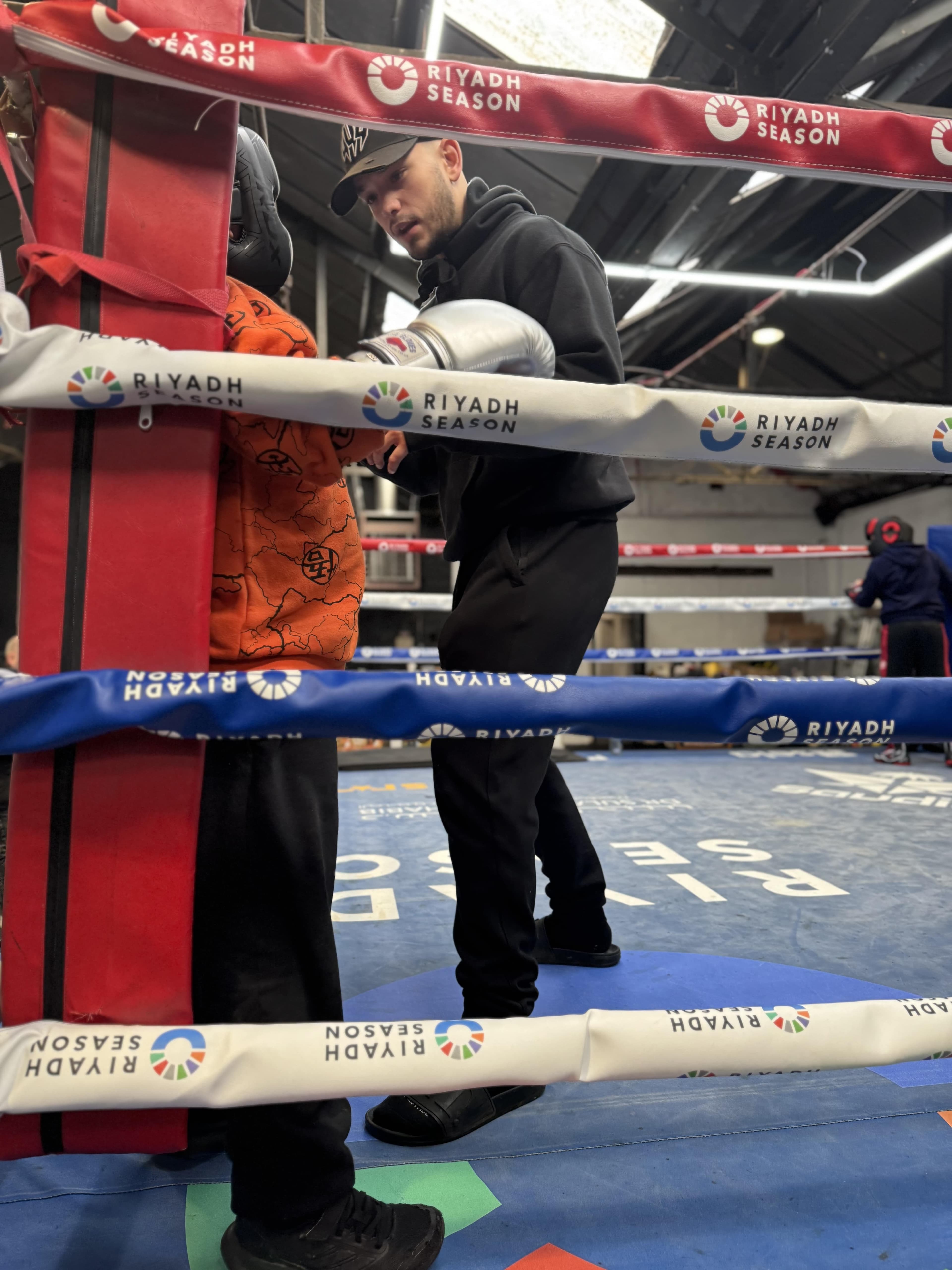 Kid with coach in corner